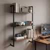 3-tier floating shelf in rustic brown, showcasing books, plants, and gaming consoles, ideal for home office or living.