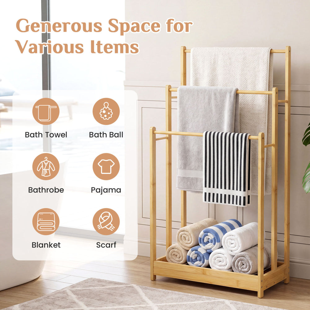 Three-tier free-standing bamboo towel rack with storage shelf, featuring ample space for drying towels and additional storage.