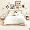 White 3-tier modern nightstand with open storage shelves, ideal for compact spaces in bedrooms or living rooms.