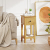 Natural 3-tier nightstand with drawer and open shelf, perfect for cozy living room or bedroom corners.