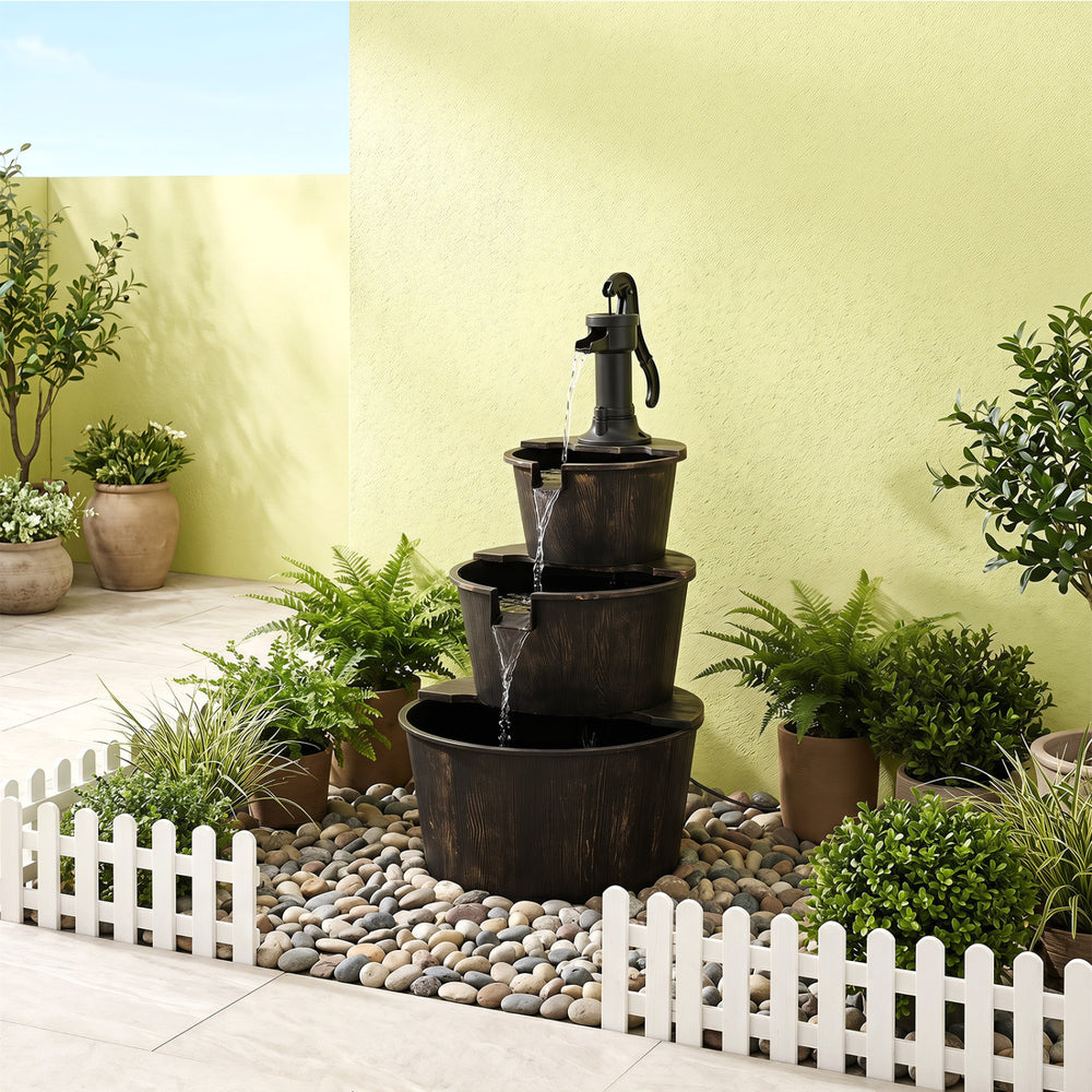 Three-tier outdoor barrel waterfall fountain with vintage bronze finish, decorative pump, and soothing water soundscape.