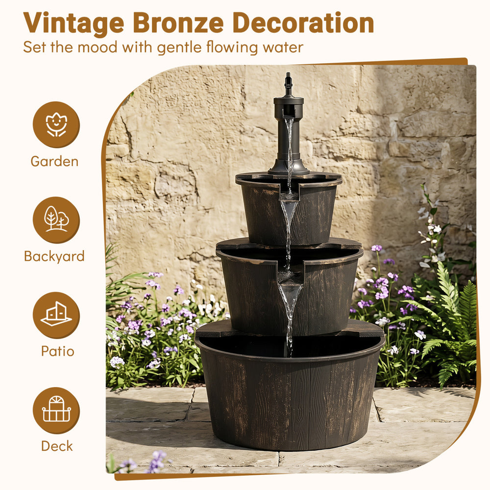 3-tier outdoor barrel waterfall fountain in vintage bronze finish, designed for gardens and patios with soothing water sounds.