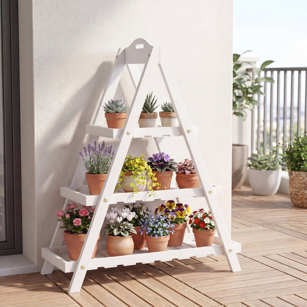 3-tier white plant stand made of solid fir wood, displaying potted plants on a balcony for indoor and outdoor use.
