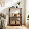 3-tier rustic brown printer stand with adjustable shelf, lockable wheels, and storage for books and plants in a living room.