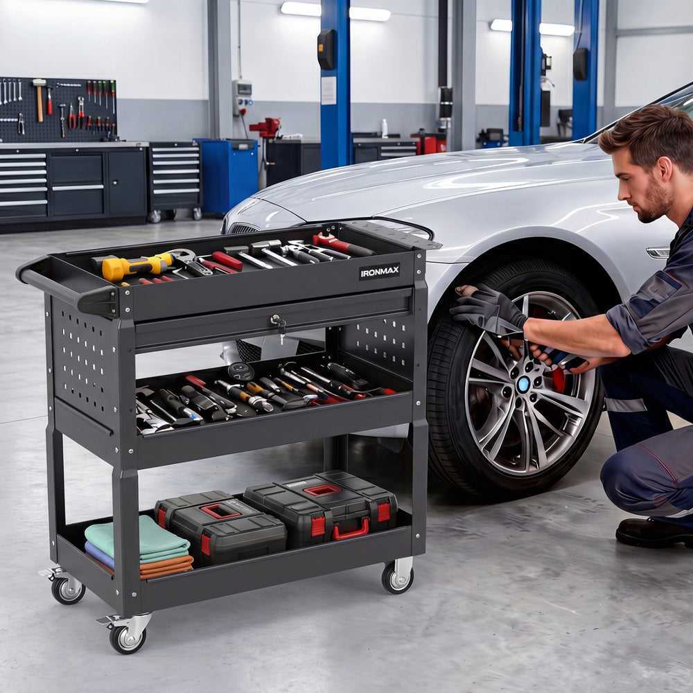 3-tier rolling tool cart in black with lockable drawer and side tool slots, ideal for garage and workshop organization.