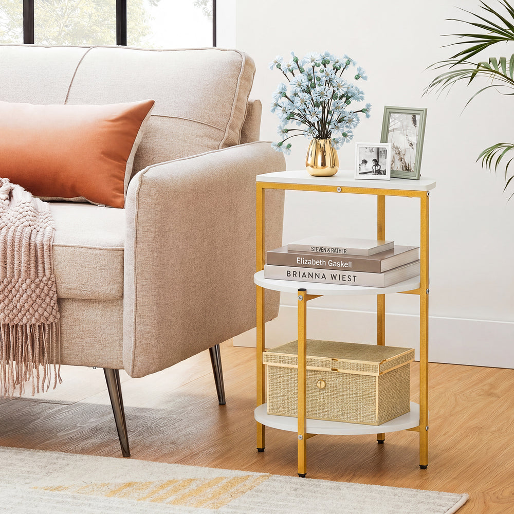 3-tier round end table with gold metal frame and white shelves, ideal for small spaces and bedroom organization.