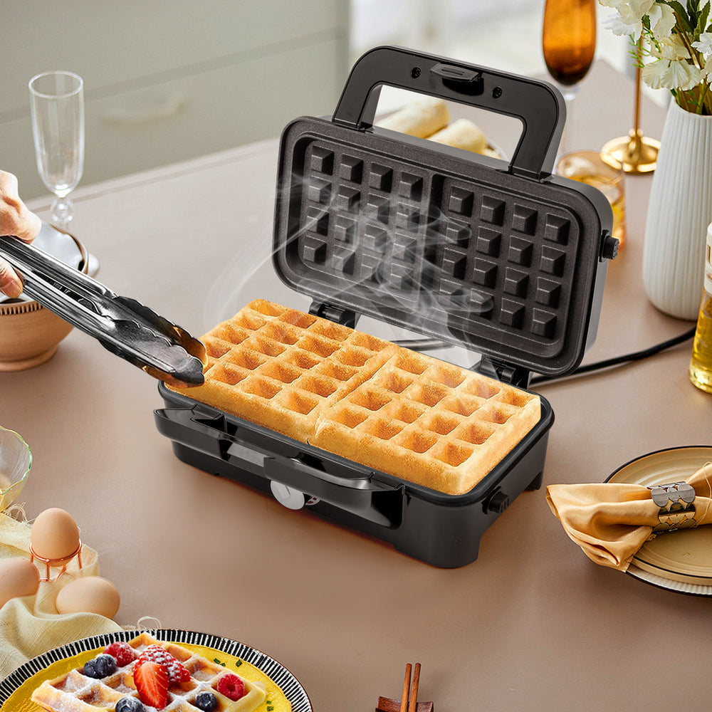 Waffle maker with non-stick plates, showcasing golden waffles, ideal for versatile cooking and easy cleaning.
