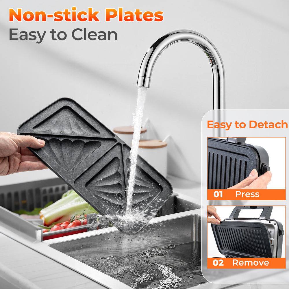 Removable non-stick plates of the 3-in-1 sandwich maker being rinsed, featuring easy cleaning and detachable design.