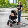 Foldable pet stroller in black with sun shade, safety belt, and spacious interior for small to medium dogs and cats.