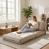3-in-1 beige folding sofa with bolster, convertible to a bed, perfect for living rooms or guest rooms.