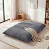 Large 3-in-1 bean bag chair in grey with soft crushed sponge filling, perfect for lounging or as a convertible bed.