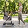 Pet stroller with removable carrier in gray, featuring a cozy interior and 180° canopy for outdoor walks.