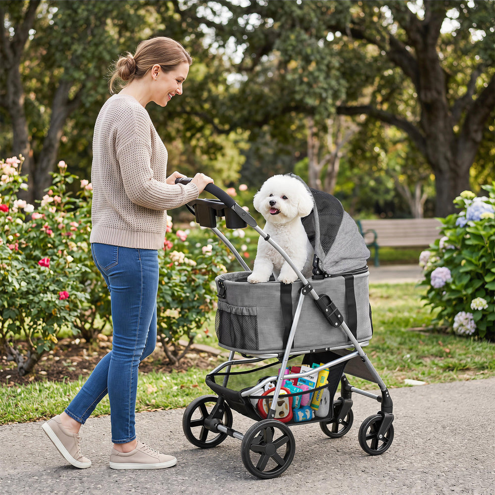 Pet stroller with detachable carrier in gray, featuring breathable mesh windows and a bottom storage basket for.