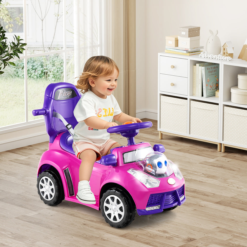 Toddler riding car in pink with steering wheel, interactive buttons, and removable guardrail for safe playtime fun.