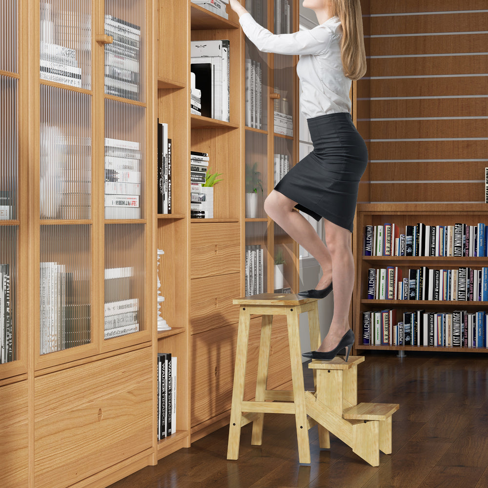 Rubber wood step stool with anti-slip surface, used as a ladder for easy access to high shelves in natural finish.