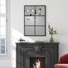 3-layered decorative wall mirror with a black metal frame, perfect for modern living room decor and easy wall mounting.