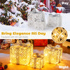 Set of three lighted Christmas gift boxes with 50 LED lights, featuring detachable bows for indoor and outdoor decor.