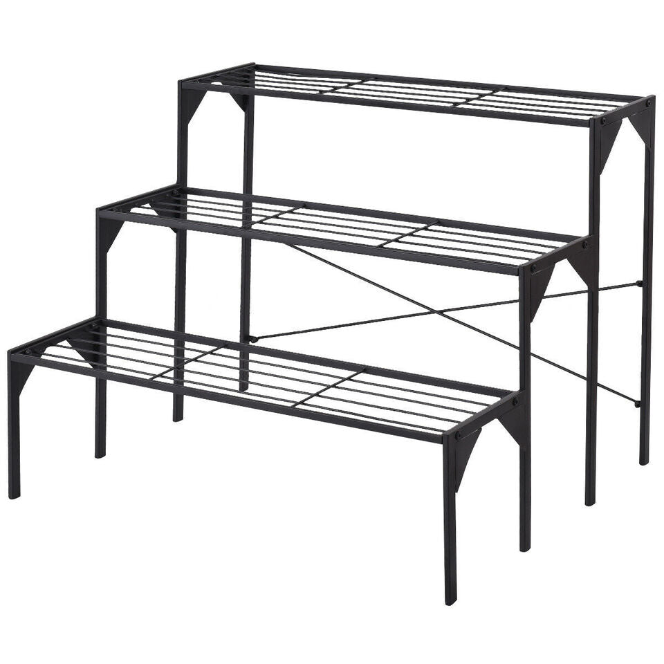 Three-tier black metal plant stand with sturdy design, ideal for displaying potted plants and decorative items outdoors.