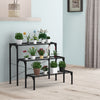 Three-tier metal plant stand in black, featuring durable steel for potted plants, perfect for outdoor or indoor decor.
