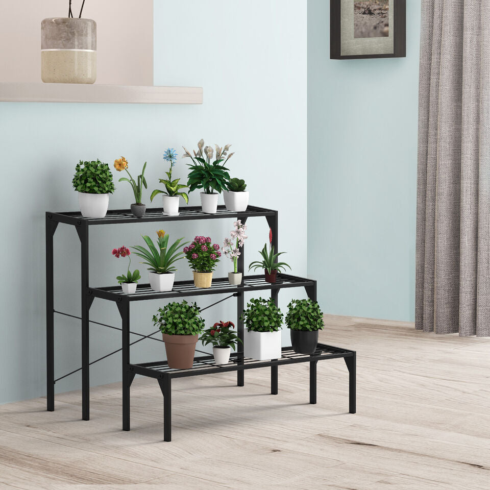 Three-tier metal plant stand in black, featuring durable steel for potted plants, perfect for outdoor or indoor decor.