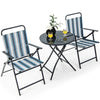 Portable folding chair set with striped fabric, round table, and comfortable armrests for backyard or poolside use.