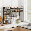 4-tier black desk shelf with metal grid panel and hooks, perfect for organizing kitchen essentials and decorations.