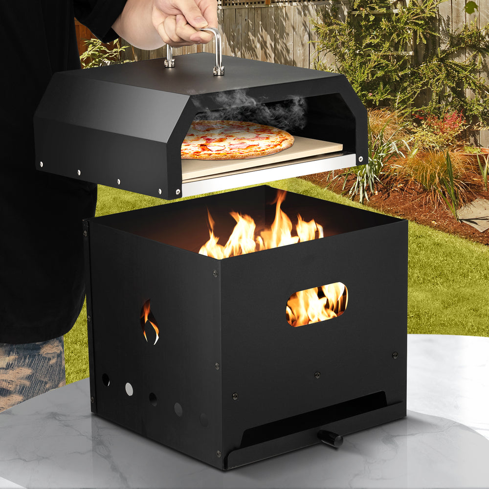 Portable 4-in-1 outdoor pizza oven with 12-inch pizza stone, featuring a stainless steel design and flames for cooking.