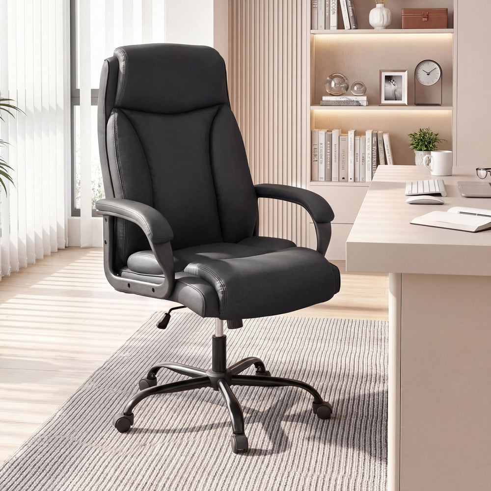 High back leather office chair designed for big and tall individuals, featuring a comfortable thick cushion and adjustable height.