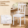 White dining chair with a spacious seat and cross backrest, designed for comfort and stability in modern dining spaces.
