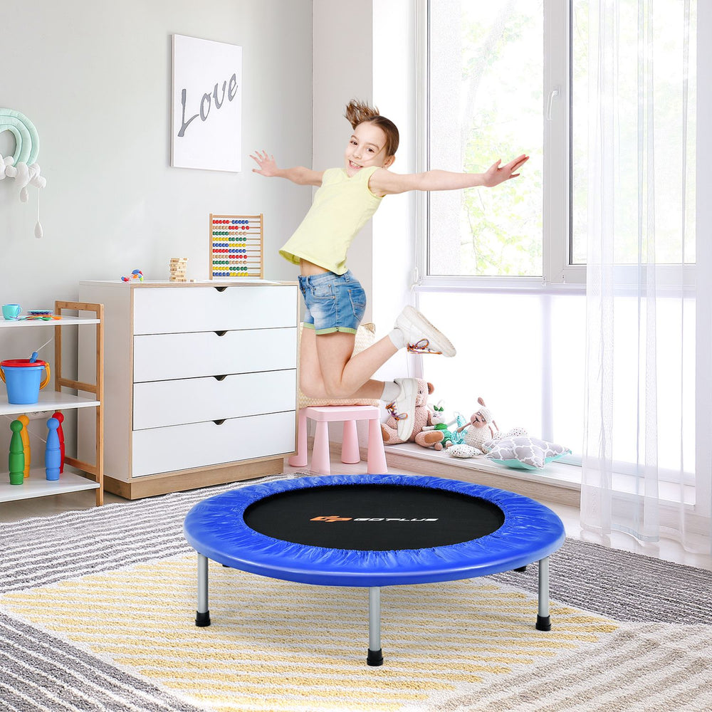A child joyfully jumps on a 40" foldable fitness trampoline with a safety pad, perfect for fun and exercise at home.