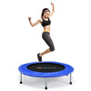 A woman jumps on a 40" foldable fitness trampoline with a blue safety pad, ideal for fun and exercise for all ages.