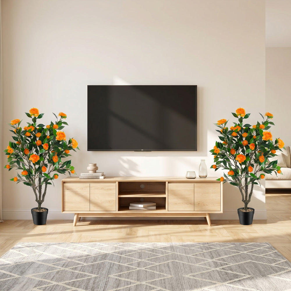 40-inch artificial camellia tree with 37 vibrant flowers and decorative river stones, perfect for living room decor.