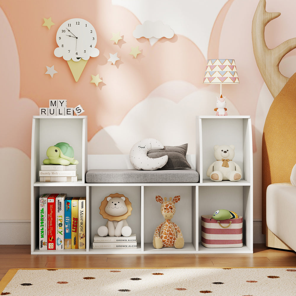 Kids bookshelf with reading nook, 6 open cubes, white finish, perfect for books and toys in a nursery or kids' room.