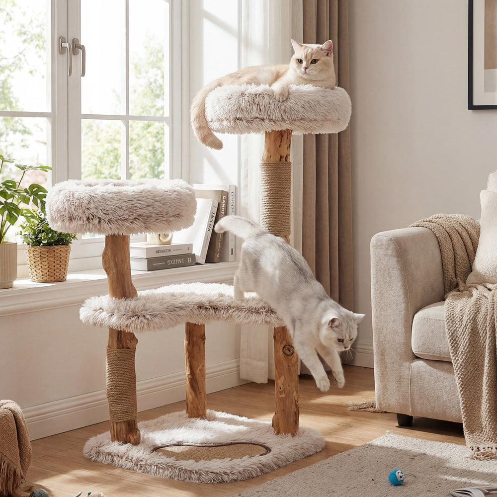 Modern cat tree tower with natural wood branches, featuring two padded perches for lounging and play in a stylish design.