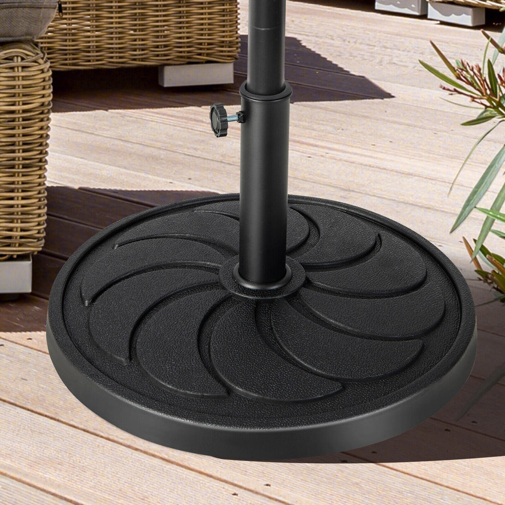 Round 40LBS outdoor umbrella base with flower-shaped pattern, made of durable resin, ideal for patio and garden use.