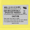 Close-up of the 735 W air blower pump fan label, featuring safety instructions and electrical ratings for inflatable.