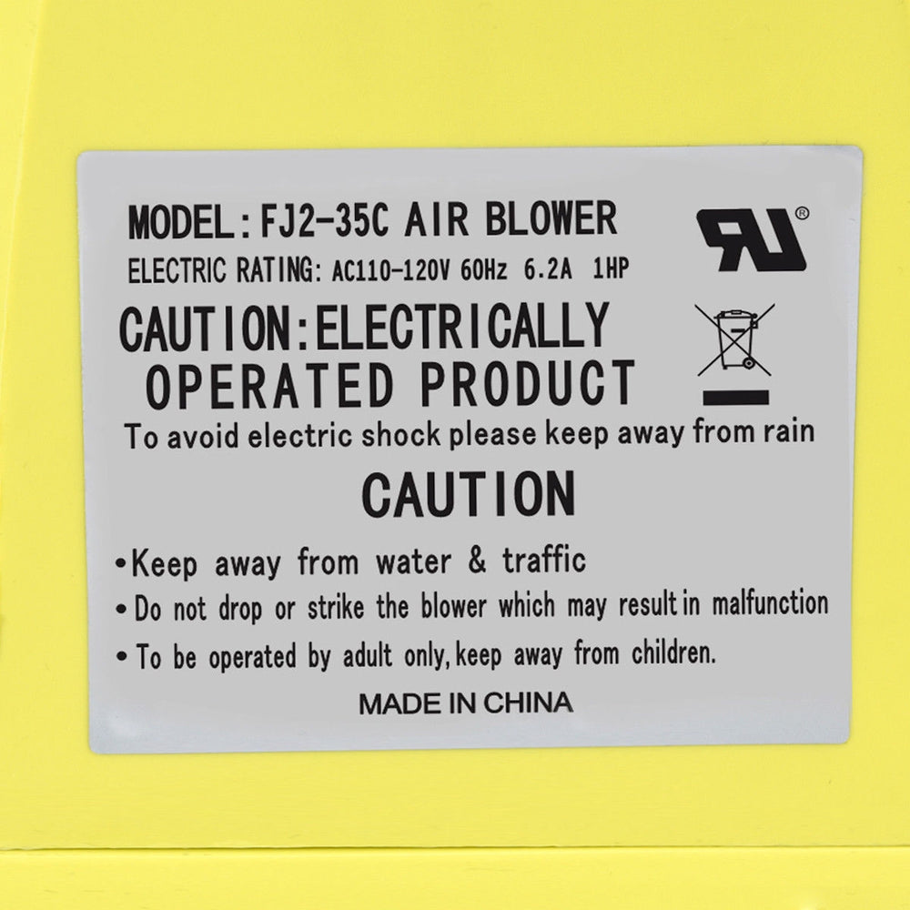 Close-up of the 735 W air blower pump fan label, featuring safety instructions and electrical ratings for inflatable.