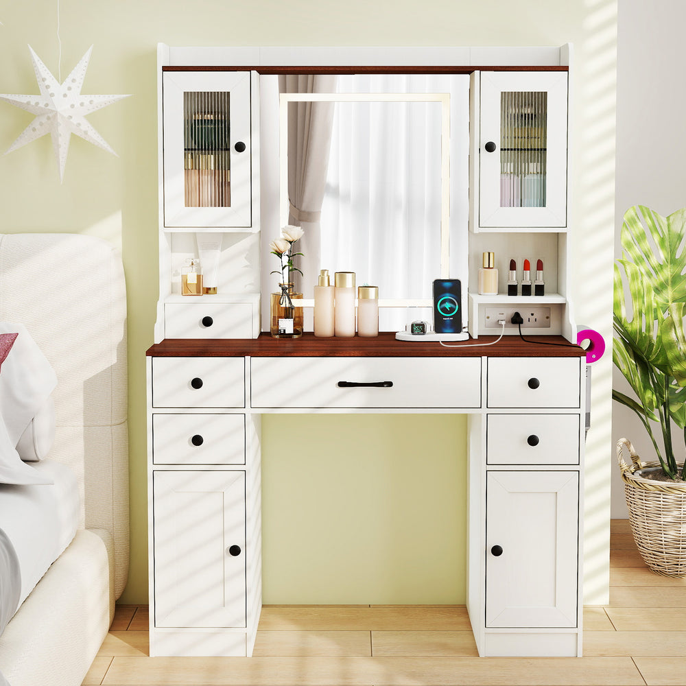 Makeup dressing table with lighted mirror, storage drawers, and power outlets, ideal for bedrooms or dressing areas.