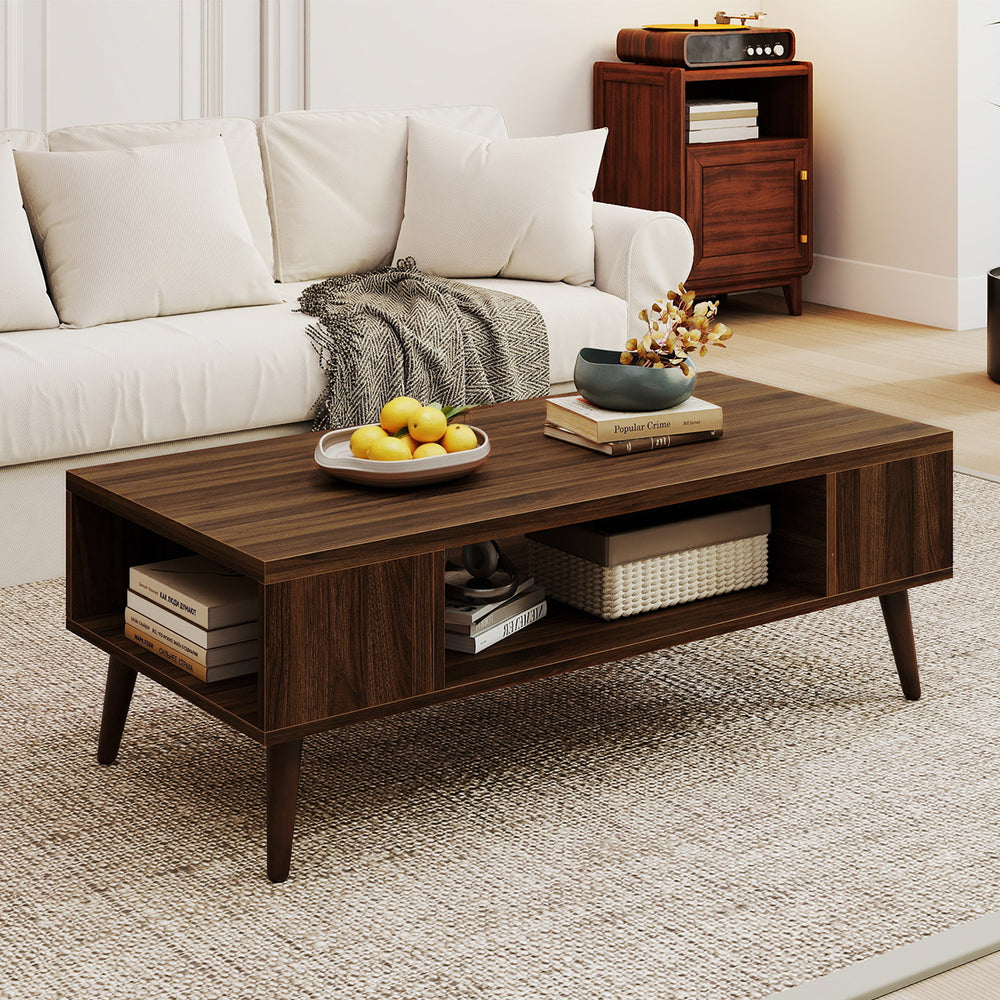 Mid-century modern 42-inch walnut coffee table featuring a wide tabletop and open compartment for easy access to.
