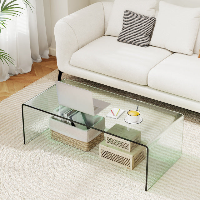 Clear tempered glass coffee table with rounded edges, 42 x 19.7 inches, ideal for a clean and elegant living room setup.