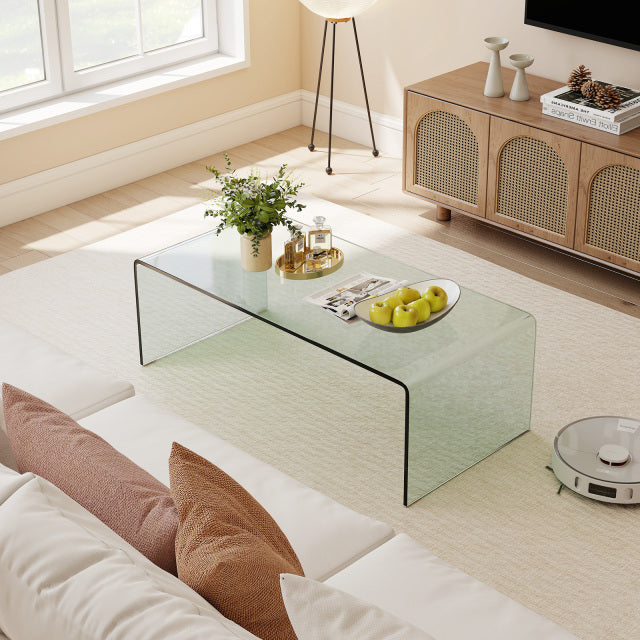 Clear tempered glass coffee table with rounded edges, 42 x 19.7 inches, featuring a sleek design for modern living.