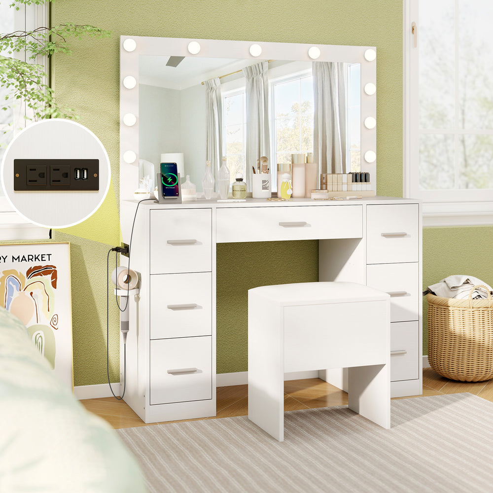 Compact white vanity desk with a charging station and stool, featuring an LED mirror for stylish bedroom convenience.