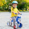 Blue baby balance bike with four wheels, carbon steel frame, and comfortable seat for safe outdoor riding.