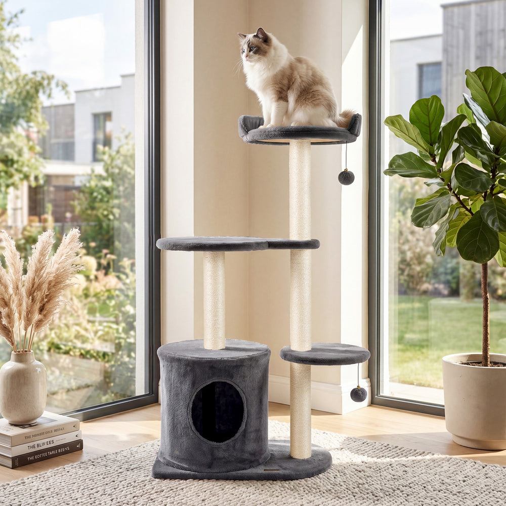 Cat tree with plush perches, sisal scratching posts, and a spacious condo for indoor cats in gray.
