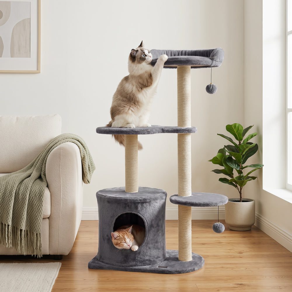 Cat tree with plush perches, sisal scratching posts, and a cozy condo for indoor cats in gray, promoting healthy play.