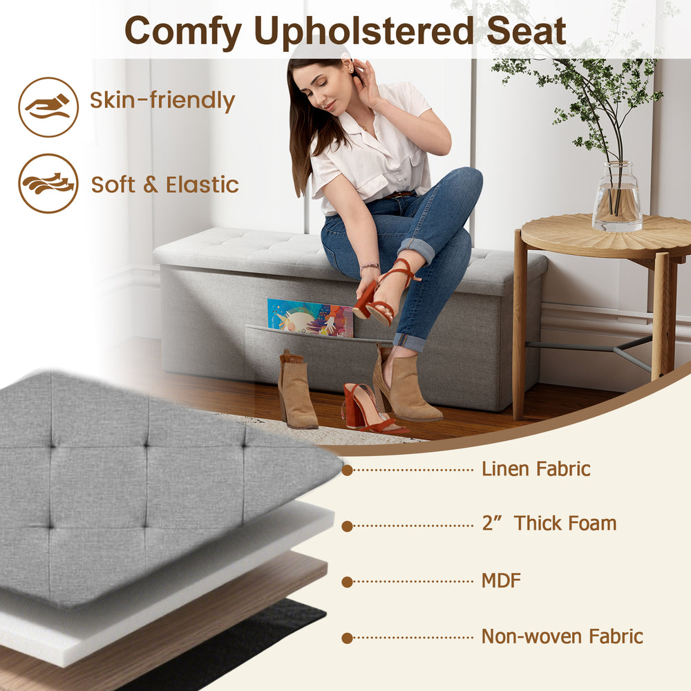 Light gray folding storage ottoman bench with padded linen seat and removable divider for versatile home organization.