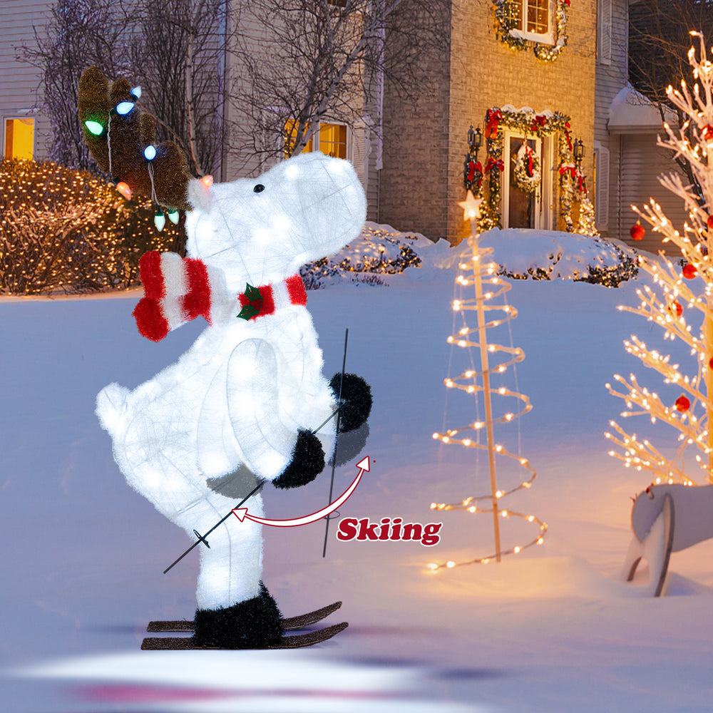 Animated 44" Christmas reindeer decoration with skiing motion, 98 LEDs, and colorful antler lights for outdoor holiday.