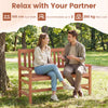 Two-seat outdoor loveseat bench made of solid wood with a teak oil finish, perfect for relaxing in the garden.