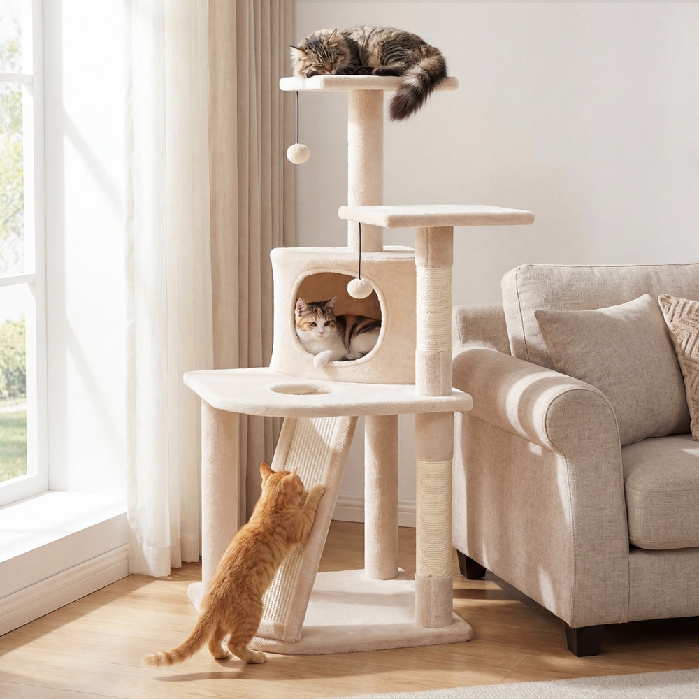 Beige 44-inch kitten tower with a central condo, sisal-wrapped scratching posts, and hanging balls for interactive play.