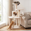 Beige 44-inch kitten tower with a central condo, sisal-wrapped scratching posts, and hanging balls for interactive play.